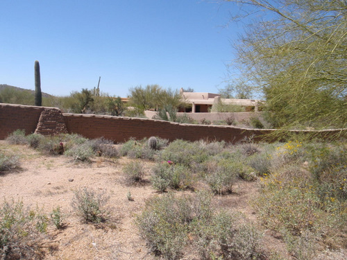 Adobe fence and southwest homes.